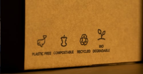 sustainability logos on cardboard packaging